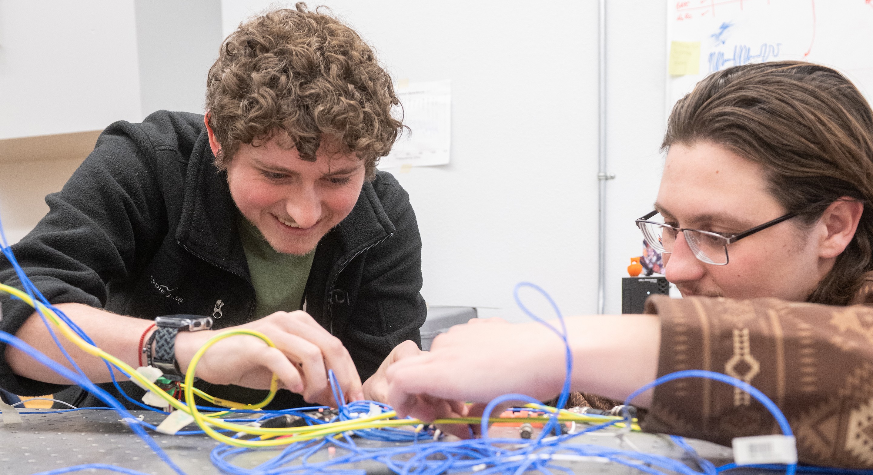 CUTLINE: Devin Binns, left, and Sevren Jackson participated in the Physical Science Laboratory’s Classified Ready Employee Workforce program at New Mexico State University, which began in 2020 and now boasts more than 80 graduates. (NMSU photo by Josh Bachman)